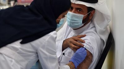 Saudi Arabia's Health Minister Tawfiq Al Rabiah receives the Pfizer-BioNTech Covid-19 coronavirus vaccine. AFP