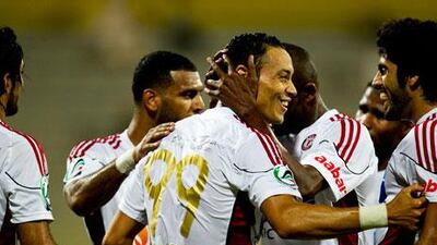 Al Jazria players celebrate.