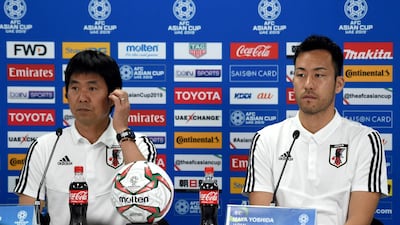 Japan's player Maya Yoshida, right, with head coach Hajime Moriyasu, left, attend the pre-match press conference ahead of the AFC Asian Cup final match against Qatar at the Zayed Sports City Stadium in Abu Dhabi. AFP
