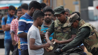 Sri Lankan army personnel search people and their bags at a check point in Kattankudy near Batticaloa, Sri Lanka April 28, 2019. Reuters