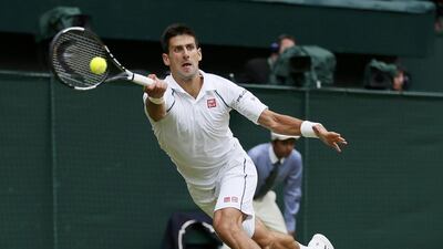 Novak Djokovic of Serbia hits a shot during the Wimbledon men's final against Roger Federer of Switzerland in London, July 12, 2015. REUTERS/Stefan Wermuth