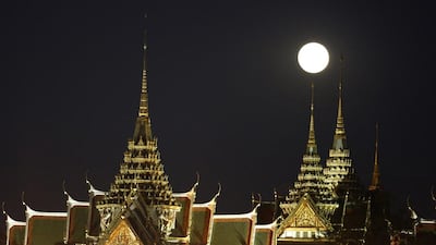 The moon rises over the Grand Palace in Bangkok, Thailand. Sakchai Lalit / AP Photo