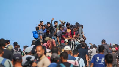 Palestinians make their way along Al Rashid road toward Gaza city. AFP
