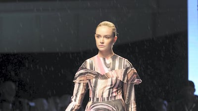 Another Rasit Bagzibagli look. The designer says of his creations: "My outfits feature intricately embellished patterns, asymmetric hems and floor-sweeping designs of cascading tulle and chiffon."