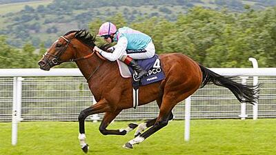 The jockey Tom Queally urges Frankel on to win the Sussex Stakes from rival Canford Cliffs by five lengths.