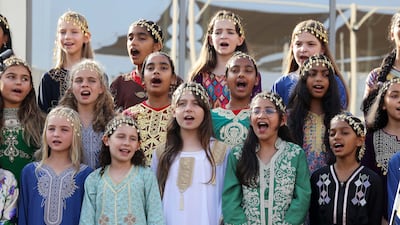 Pupils, dressed in traditional attire, perform during the celebrations. Pawan Singh / The National