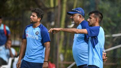 India spinners Kuldeep Yadav, left, and Yuzvendra Chahal, right, talk to bowling coach Bharat Arun in Hyderabad. AFP