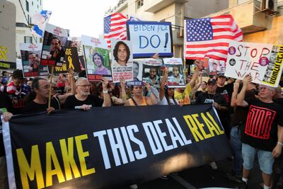 Supporters of Israelis kidnapped during the October 7 Hamas-led attacks, demand their immediate release, outside the venue of an event attended by US Secretary of State Antony Blinken in Tel Aviv on Monday. Reuters