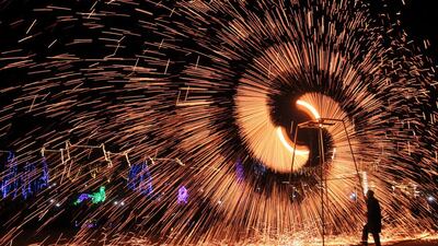 A folk artist creates sparks at the lantern festival in Anyang, Henan province, China, February 11, 2017. Reuters
