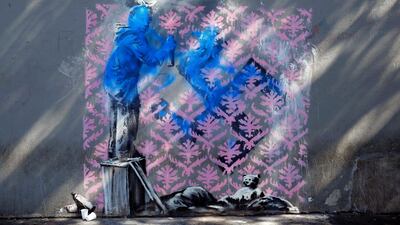 A graffiti believed to be attributed to street artist Banksy is seen on a wall in Paris AP