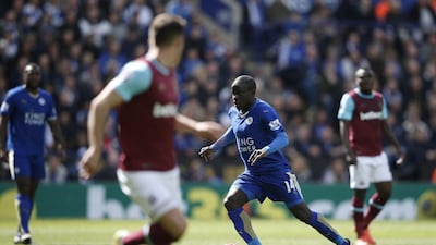 Leicester City's French midfielder N'Golo Kante runs with the ball during their English Premier League football match against West Ham United at King Power Stadium in Leicester, central England on April 17, 2016. AFP PHOTO / ADRIAN DENNIS