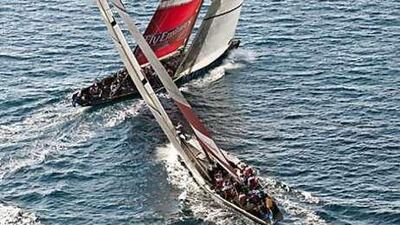 Artemis and Emirates Team New Zealand slug it out in the water.