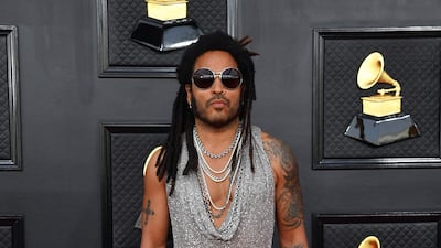 Lenny Kravitz, wearing a silver top and leather trousers. AFP