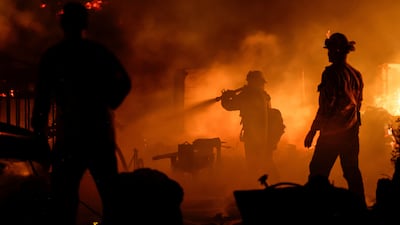 Firefighters battle a blaze near Chico, California. Reuters
