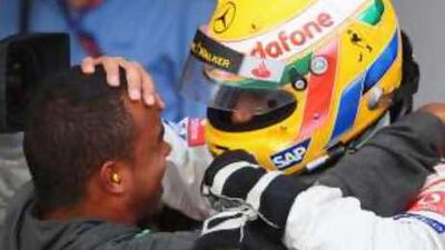 Martin Whitmarsh believes that Lewis Hamilton, pictured celebrating his Silverstone win with his brother Nick, can get even better.