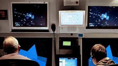 Air traffic controllers keep an eye on the radar screen at Dubai International Airport. Stephen Lock / The National