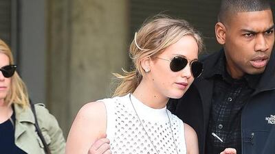 Jennifer Lawrence carries the studded Tatum tote by Coach at JFK airport. Courtesy of Coach