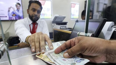 A total of Dh169.2 billion was sent from the UAE last year, according to the Central Bank’s 2018 annual report. Pawan Singh / The National