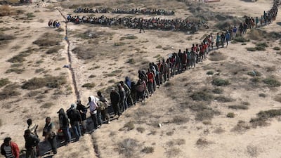 Migrants wait to be transported to a detention center, in the coastal city of Sabratha, Libya. Hani Amara / Reuters