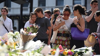 Flowers left by London Bridge on the first anniversary of the June 2017 terror attack there. Getty Images
