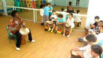 The Senegalese musician Babacar Boyé gives a class in djembe, a skin drum common throughout west Africa, to children at the Ecole La Prairie, a private primary school in Casablanca.