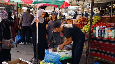 A man sells olives at a market in Deir Al Balah, central Gaza. Reuters