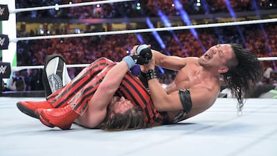 Shinsuke Nakamura tries to put a submission move on AJ Styles at the WWE Greatest Royal Rumble in Jeddah, Saudi Arabia. Courtesy WWE