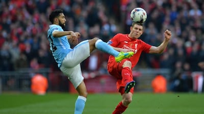 Manchester City’s French defender Gael Clichy vies with Liverpool’s English midfielder James Milner (R) during the League Cup final football match between Liverpool and Manchester City at Wembley Stadium in London on February 28, 2016. AFP / GLYN KIRK
