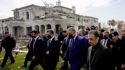 Iraqi Prime Minister Mustafa Al Kadhimi inspects the site of a damaged building a day after a missile attack in Erbil. Reuters