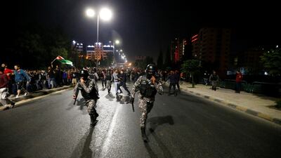 Demonstrators clash with riot police. Muhammad Hamed / Reuters