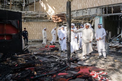 Prime Minister Sheikh Ahmad Al Abdullah Al Sabah inspects damage to Kuwait City's airport after an Iranian attack. AFP