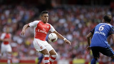 Arsenal's Alexis Sanchez, left, takes on Monaco's Ricardo Carvalho during their Emirates Cup match at Arsenal's Emirates Stadium in London on August 3, 2014. Matt Dunham / AP Photo
