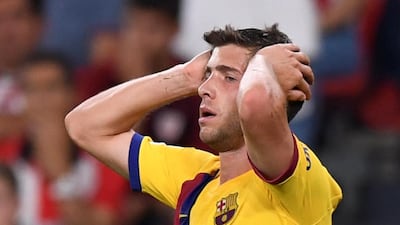 Barcelona's Sergi Roberto also cuts a dejected figure as the writing is on the wall. Reuters
