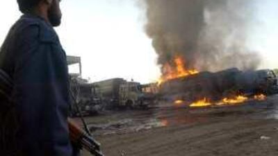 Lorries loaded with supplies for Nato forces in neighbouring Afghanistan have been targeted by militant factions in Peshawar.