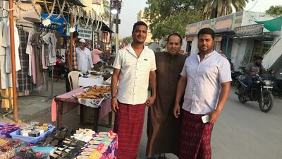 Mahmood bin Ali Balahwal, far right, is a resident of Barkas who works in the UAE.