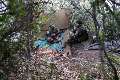 Fighters affiliated to Hayat Tahrir Al Sham in Syria's north-western Latakia province. AFP