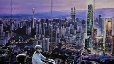 A poster showing Kuala Lumpur's future city skyline in Malaysia. Smart cities offer opportunities for investors. EPA