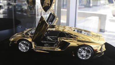 The gold-plated and diamond studded prototype of the Aventador is the most expensive model artist Robert Gulpen has ever made. Sarah Dea / The National