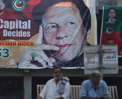 Campaign poster for Imran Khan's Pakistan Tehreek-e-Insaf (Movement for Justice) party. Aamir Qureshi / AFP