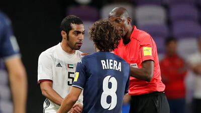 Al Jazira’s Musallem Fayez clashes with Auckland City’s Albert Riera as referee Malang Diedhiou looks on. Reuters