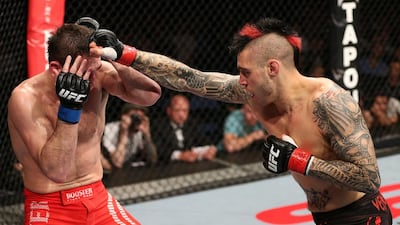 Top: Dan Hardy, right, again Amir Sadollah in Nottingham, England in 2012. The Englishman launched a scathing attack on the US health-care system, who he claims are trying to make him undergo unnecessary surgery for Wolff-Parkinson-White syndrome, a heart disorder where the presence of an extra, abnormal electrical pathway in the heart can lead to periods of accelerated heart beat, before they give him a licence to compete in UFC again. Below: ‘The Outlaw’ will be part of the commentary team at Yas Island on Friday. Josh Hedges / Getty Images