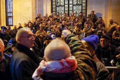 Retired members of Lebanon's security forces gather at the entrance of the Lebanese Parliament building during the parliamentary session scheduled to approve the state budget. EPA