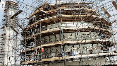 Scaffolding surrounds part of Sheikh Zayed Grand Mosque during construction. Getty Images