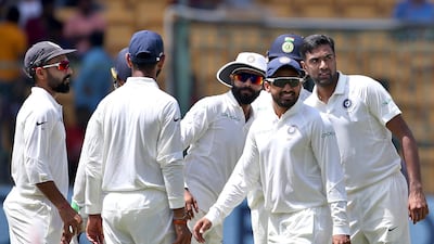 India off-spinner Ravichandran Ashwin, right, took a match-total of five wickets. Aijaz Rahi / AP Photo