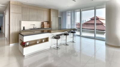 The kitchen looks out over the Anantara The Palm Dubai Resort. Courtesy Luxhabitat Sotheby's International Realty