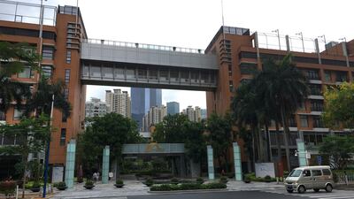 A van passes high-rise apartment buildings in The Canton Place where US government workers experienced unexplained health issues in Guangzhou in south China's Guangdong province, Thursday, June 7, 2018. Kelvin Cha / AP