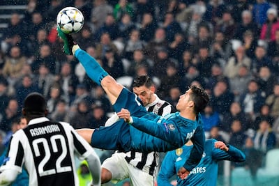 Cristiano Ronaldo scores his second goal for Real Madrid against Juventus with an overhead kick. Alberto Pizzoli / AFP