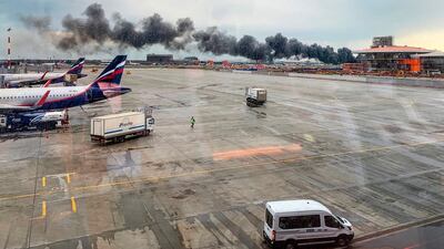 Smoke billows out across the airport. AFP.