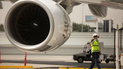 A ground staff worker signals a plane is clear. The new visa roll out is expected to draw more visitors with Dubai gearing up for an influx of visitors over the winter.