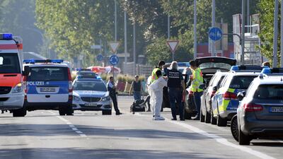 Ambulances and police cars stand near a discotheque in Constance, at Lake Constance, Germany, Sunday, July 30, 2017. Police say a shooting in Germany’s Baden-Wurttemberg state has claimed two lives, including that of the gunman. They say the early-morning shooting Sunday at a discotheque in the town of Constance also left three guests seriously wounded. A tweet by Constance police says one person was killed by the shooter when he opened fire, also wounding the other victims. He then fled, was shot by police and died later in hospital. (Felix Kaestle/dpa via AP)